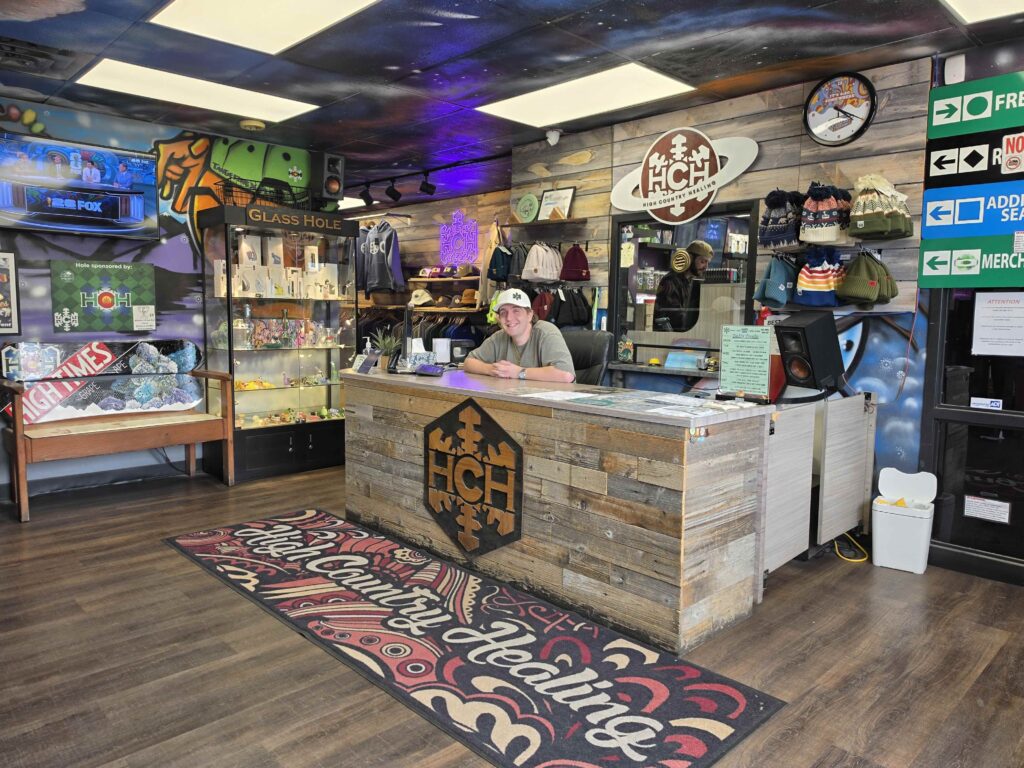 Shop storefront with friendly sales associate